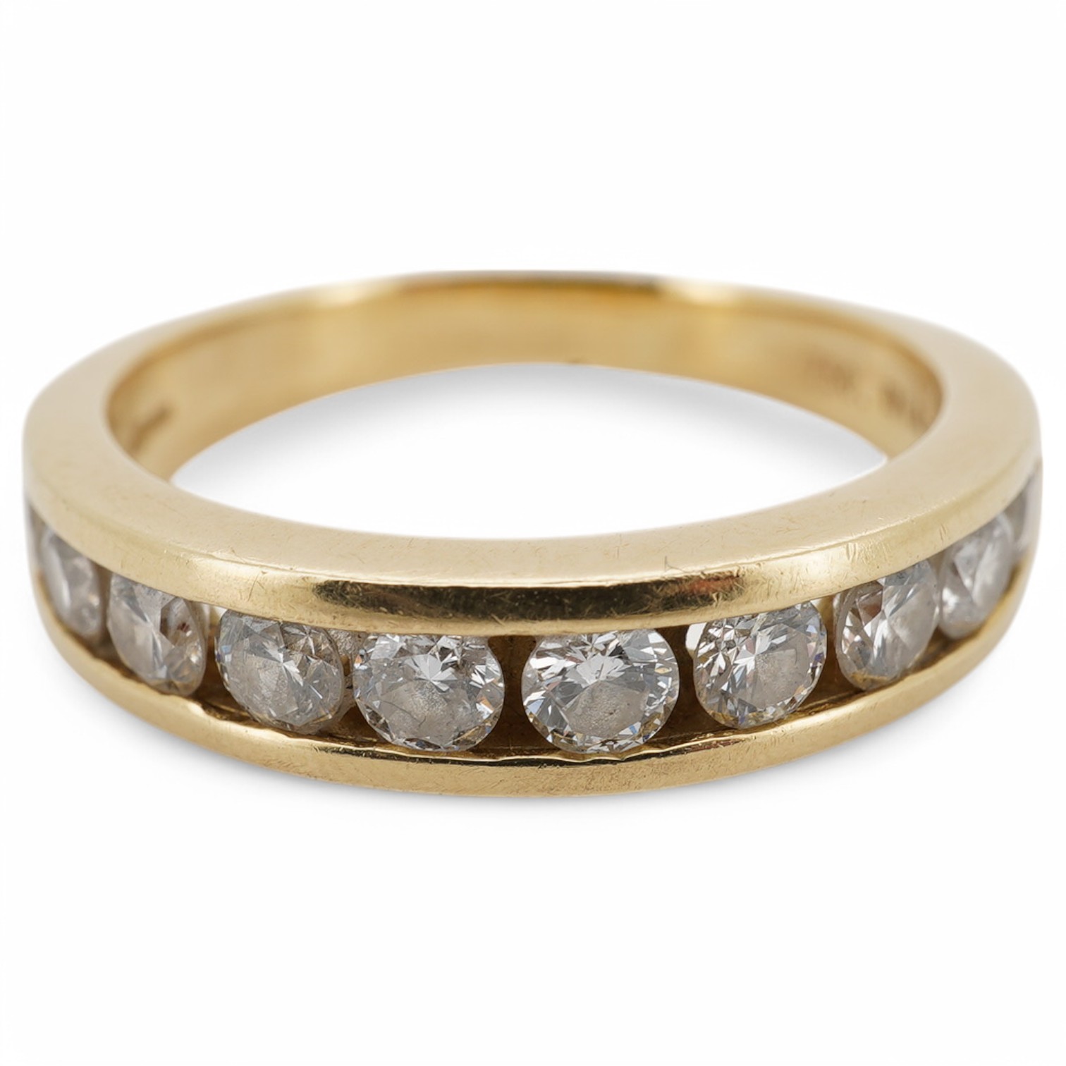 A modern 18ct gold and ten stone channel set diamond half hoop ring, size Q, gross weight 5.8 grams. Condition - fair to good